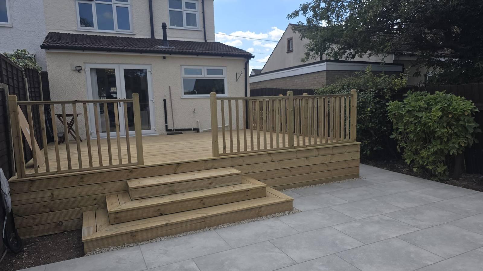 A porcelain patio and timber deck installed by D&A Contractors