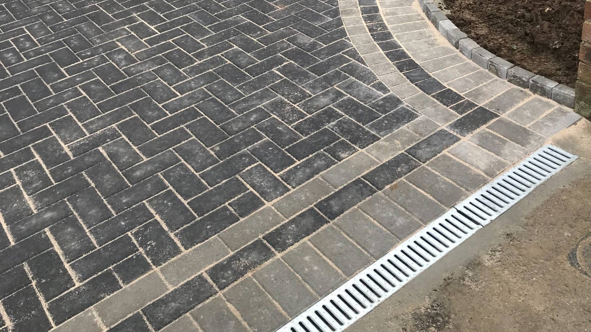 Block paving driveway with curved soldier course edging and channel drainage, installed by D&A Contractors in Medway
