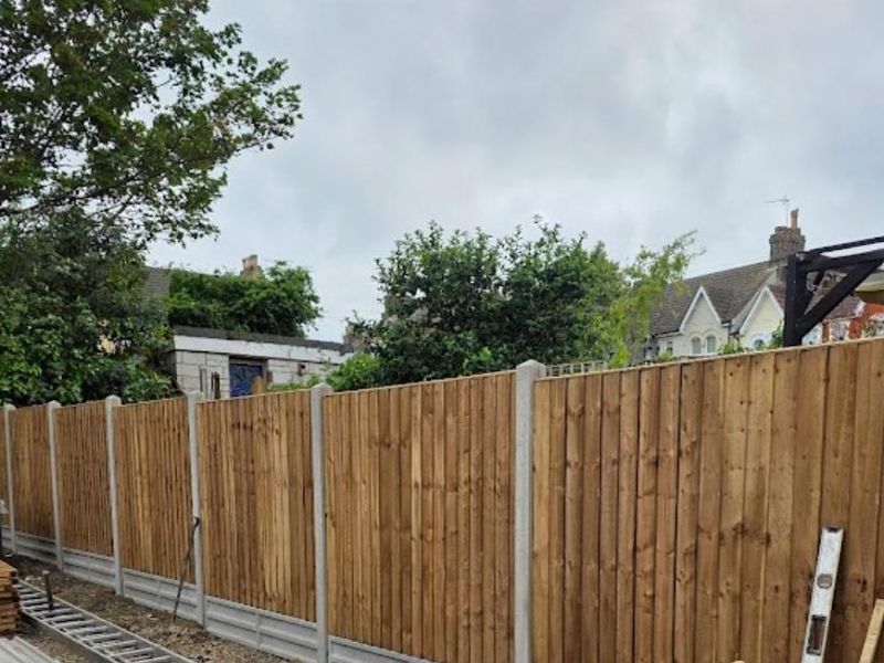 A finished closeboard fence run in treated timber